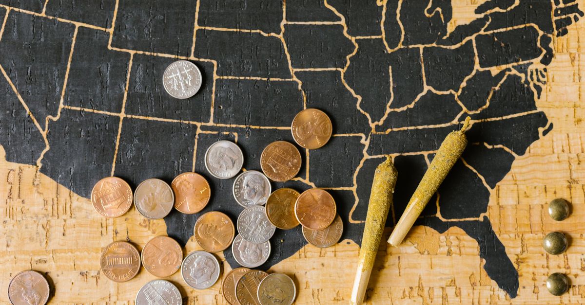 A USA map with cannabis joints and coins, symbolizing legal marijuana and its economic impact.